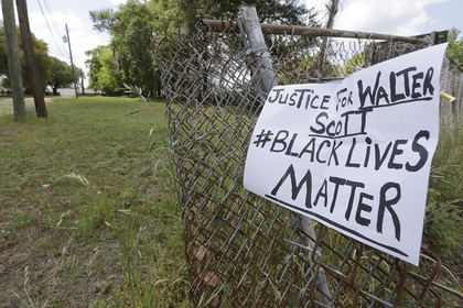Семье убитого полицейским чернокожего в США выплатят 6,5 миллиона долларов